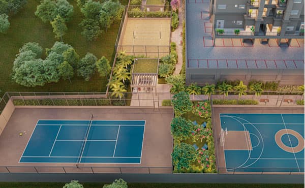 Vista aérea de quadras esportivas e áreas de convivência arborizadas.