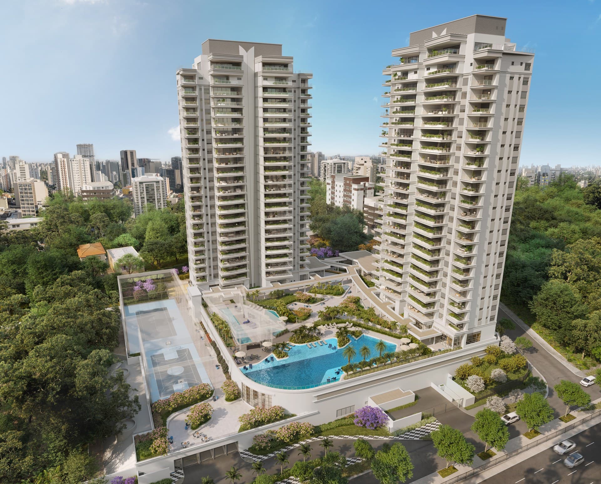 Vista aérea frontal das torres residenciais com ampla área de lazer e vegetação